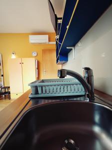 a kitchen with a sink and aaucet at Studio Celjeapp in Celje +14 photos