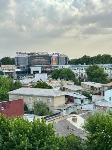 a view of a city with buildings and a scoreboard at Tamerlane Premium Apartment in Samarkand +2 photos