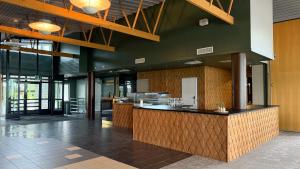a lobby with a counter in a building at Tiera Resort in Taivalkoski