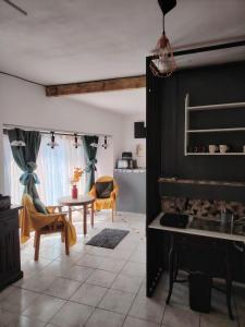 a living room with a fireplace and a table and chairs at Studio Kyllburg-Eifel in Kyllburg