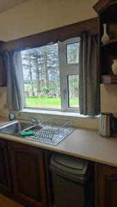 a kitchen counter with a sink and a window at Glencar in Sligo