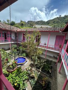 a view from the balcony of a house at La Casa Rosada Hostel in Jericó