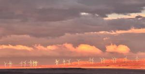 a group of windmills in the desert under a cloudy sky at Espacio parque 1D y 1B in Calama