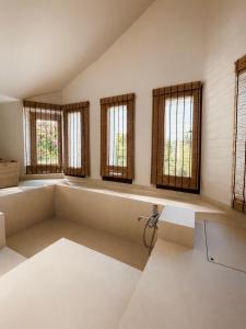 a large room with windows and a bench in it at Sea & Salt ,Pelion,Agria Volos in Agria