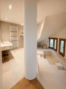 a large white room with a staircase in a house at Sea & Salt ,Pelion,Agria Volos in Agria +28 photos