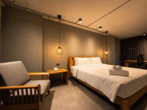 เตียงในห้องที่ โรงแรมเซ็นทริคเพลส