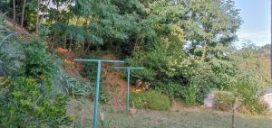 two green street lights in a garden with trees at Chambre très calme in Montélimar