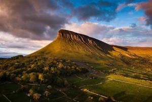 a view of a mountain with a cloudy sky at Glencar in Sligo