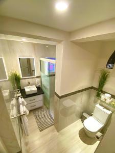 a bathroom with a toilet and a sink at Jadens Guest House - by ZenBreak in Saint Michael +11 photos