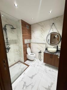 a bathroom with a toilet and a sink at Assafa in Agadir