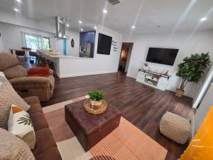 a living room with a couch and a table at Varadero Magical Scape in Miami