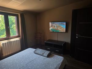 a bedroom with a bed and a painting on the wall at Petra in Poreč