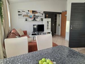 a living room with a couch and a table at Nova Residence in Pula