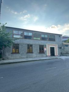 a building on the side of a street at Khan House in Sheki +14 photos