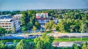 an aerial view of a city with a park at Q Hotel in Neptun