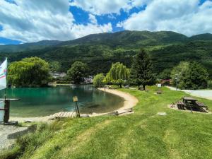 a view of a lake with mountains in the background at Valtellina home in Grosotto