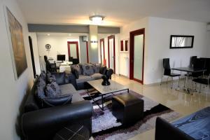 a living room with couches and a dining room at Anesis in Ioannina +67 photos