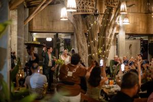 a bride and groom walking down the aisle at a wedding at Hotel Makaabá Eco-Boutique in Bacalar +171 photos