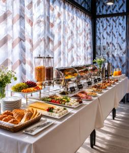 a buffet line with appetizers and fruits and bread at Villa MD Grigoleti in Grigoleti