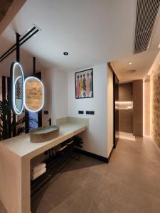 a bathroom with a sink and a mirror at La Kasilla in Baeza