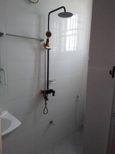 a shower in a bathroom with a glass door at Katavi Empire Hotel in Mpanda