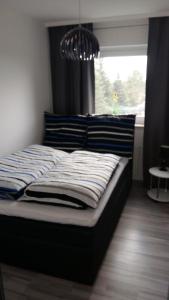 Postel nebo postele na pokoji v ubytování Ferienwohnung Am Steinberg