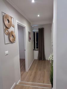 a hallway with white walls and wooden floors at The Terry Inn in Frascati
