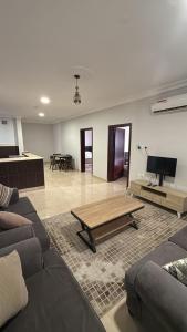 a living room with a couch and a coffee table at Al-Dana 6 in Al Wajh