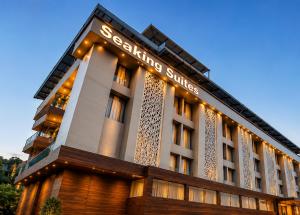a building with a sign on the side of it at Seaking Suites-MG Road in Cochin
