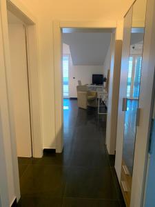 a hallway with a living room and a dining room at Apartment Vodice - Lovric in Vodice