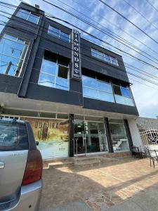 a building with a sign on the front of it at Hotel Diamonds in Ríohacha