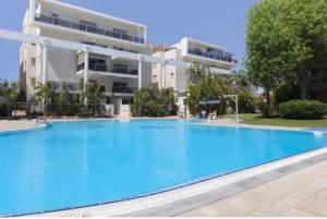 a large swimming pool in front of a building at רויאל דרים אילת in Eilat