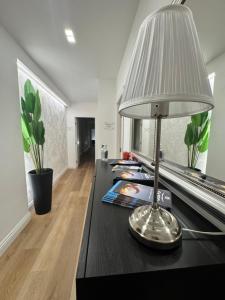 a table with a lamp on top of it at Maison Trentasette in Potenza