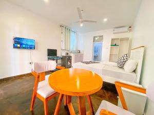 a living room with a table and a couch at 9 bedroom Villa in Mombasa