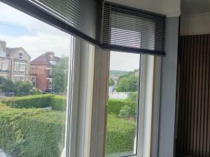 a window with a view of a yard at Dover White Cliff Apartment in Dover