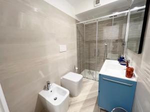 a bathroom with a toilet and a sink and a shower at Jblago in Arona +9 photos