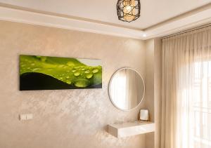 a bathroom with a sink and a mirror at Nador Skyline Al Matar in Nador