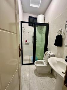 a bathroom with a toilet and a sink at Hilm cottage in Āwasa +16 photos