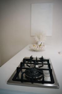a black stove top with a white counter top at Villa Zen - 1 Bedroom Studio in Saint James +7 photos