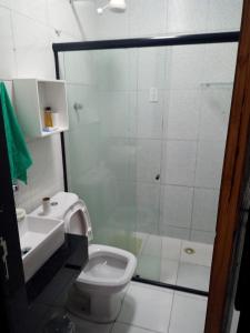 a bathroom with a shower and a toilet and a sink at recanto sossego in Garanhuns +17 photos