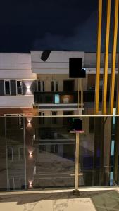 a view of a building at night with a street at The bliss spot in Lekki