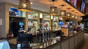 a bar with a lot of liquor bottles at Casa Dana in Jaywick Sands