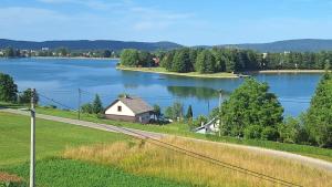 a house on a island in a large lake at Lake Crown in Ogulin