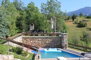 a swimming pool in a yard with a lazy river at nKulle in Boge