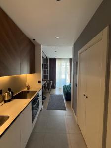 a kitchen with a sink and a counter at BW LUX STUDIO-Belgrade Waterfront in Belgrade