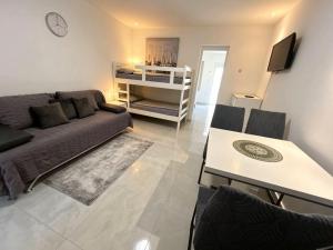 a living room with a couch and a table at My Miracle Stinica in Stinica