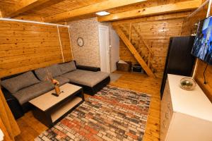 a living room with a couch and a table at SmallGrin Ada Bojana in Ulcinj