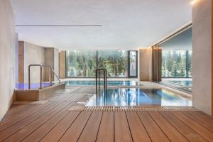 a house with a swimming pool with a view at Tavel Hotel & SPA in Bukovel