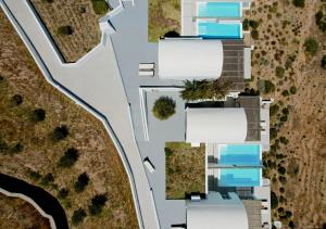 an aerial view of a house with a road at Thimari Lodge in Fira