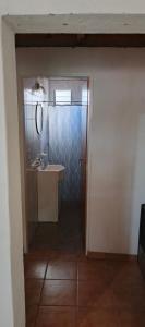 a small bathroom with a sink and a mirror at Palo Blanco in Cinco Saltos +12 photos